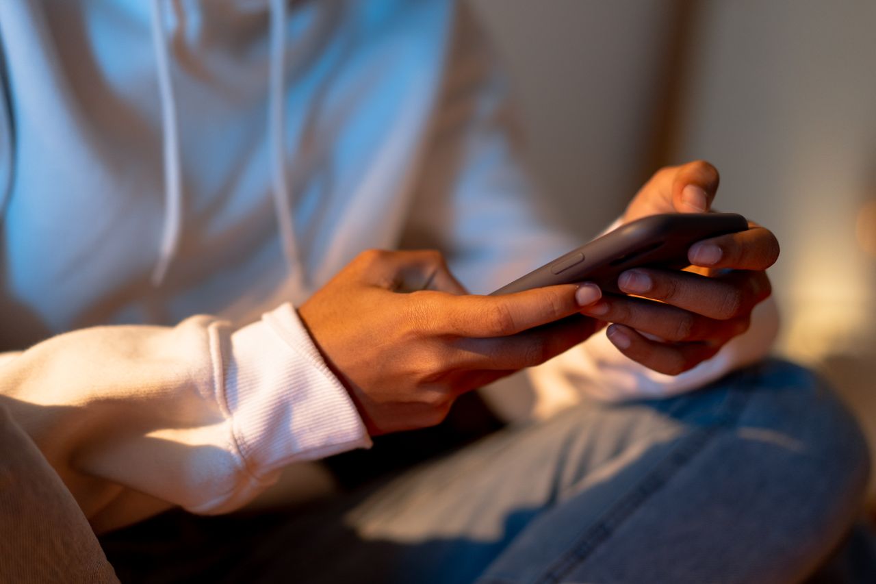 Close-up of hands holding a smartphone