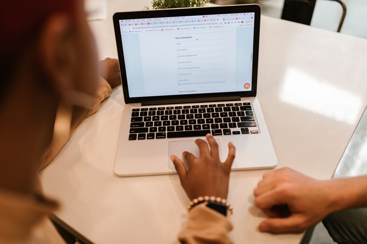 Person typing personal information into an online form