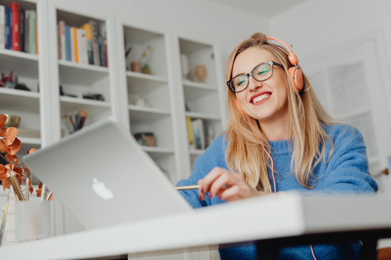 Woman browsing an online community on her laptop