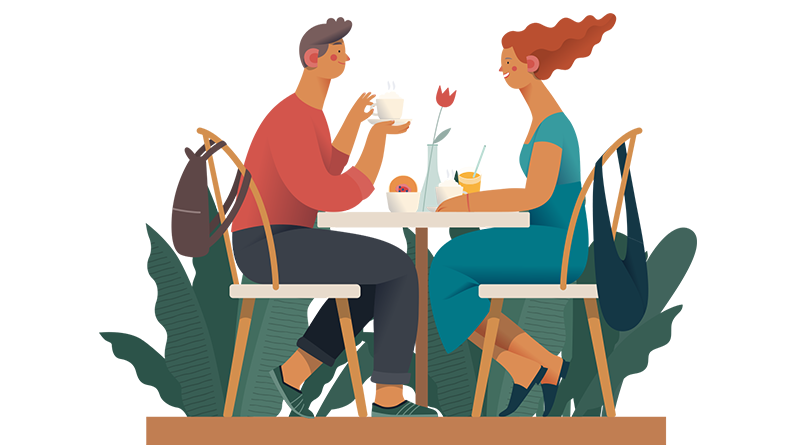 Two people chatting over coffee at a cafe table